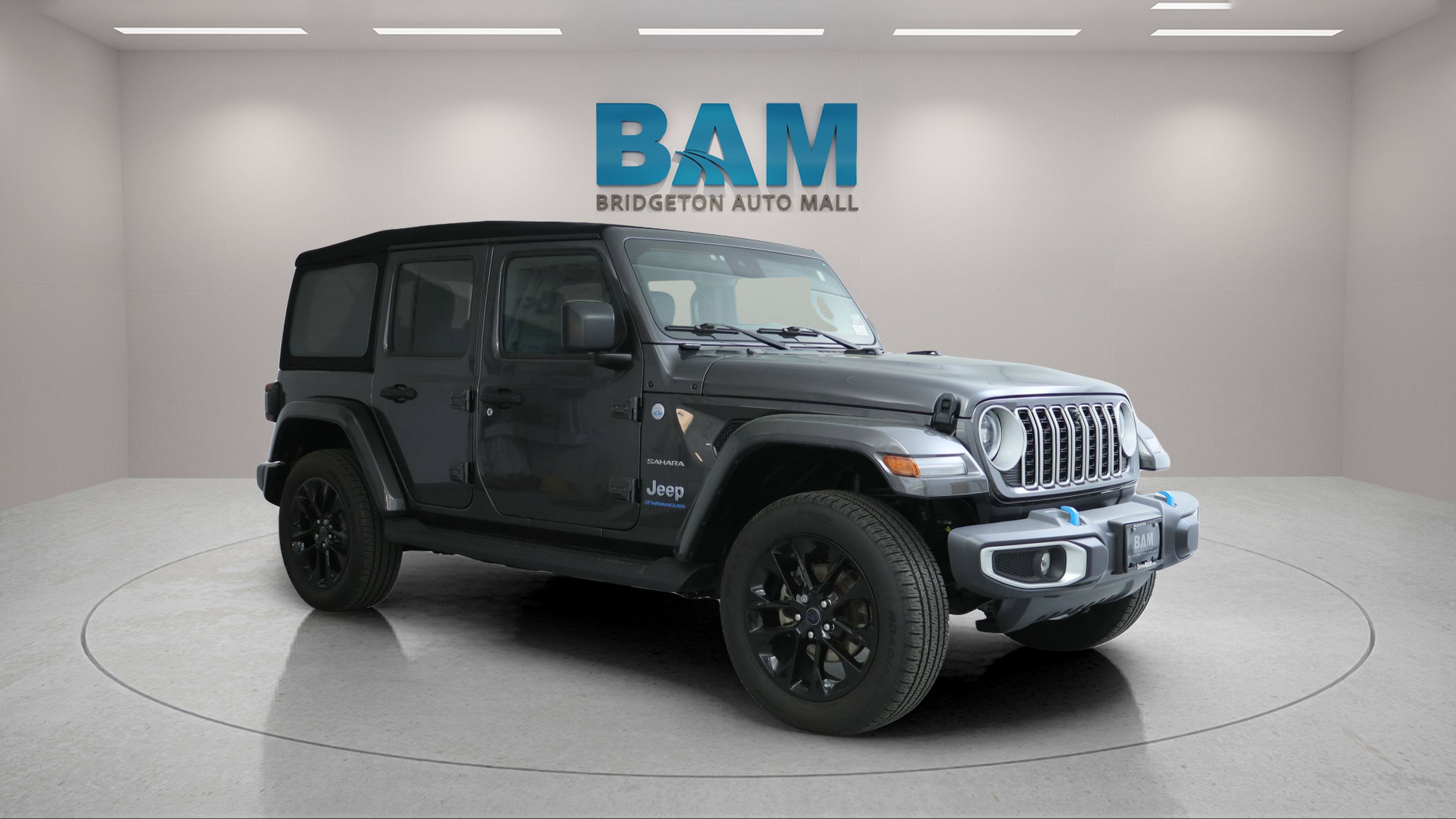 2024 Jeep Wrangler 4xe Sahara 4xe in Granite Crystal Metallic Clearcoat — front three-quarter view