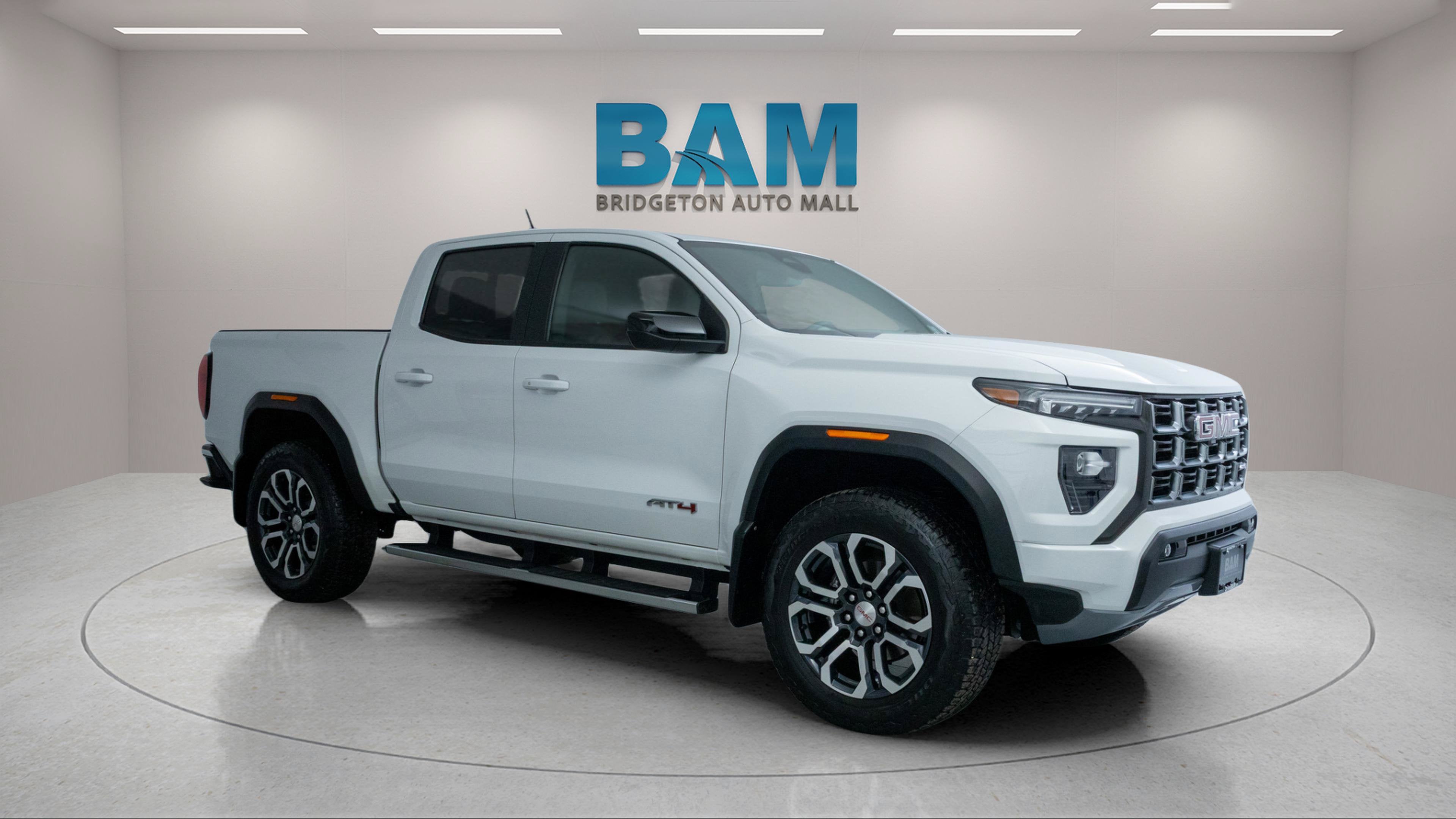 2023 GMC Canyon 4WD Crew Cab Short Box AT4 in Summit White — front three-quarter view